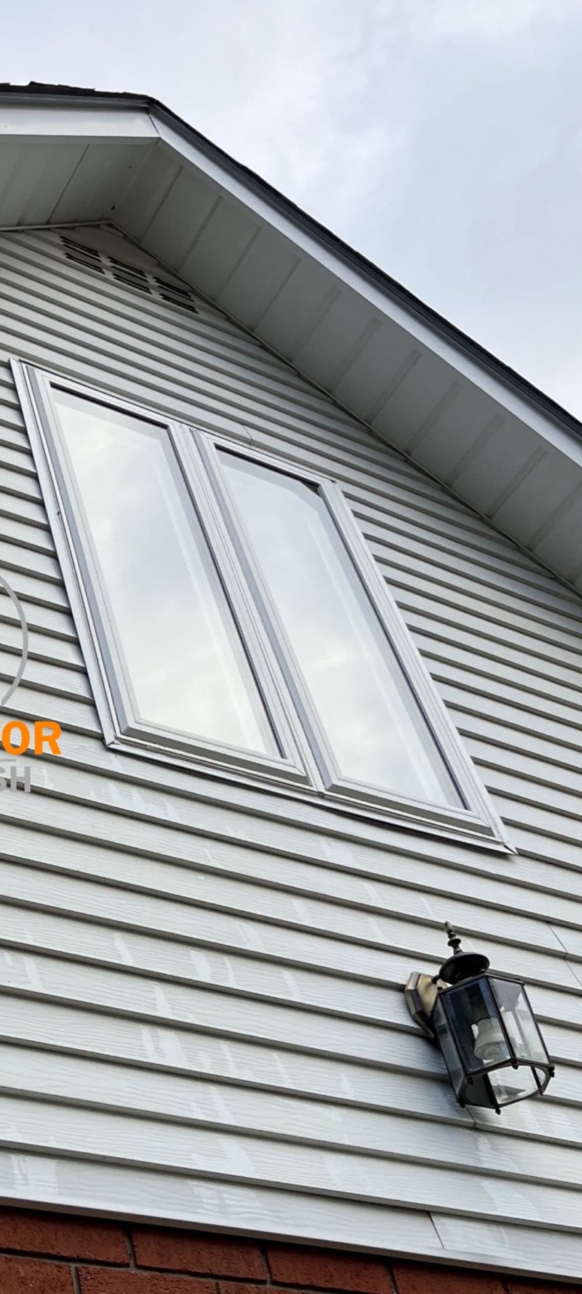 White siding, north gable — after cleaning
