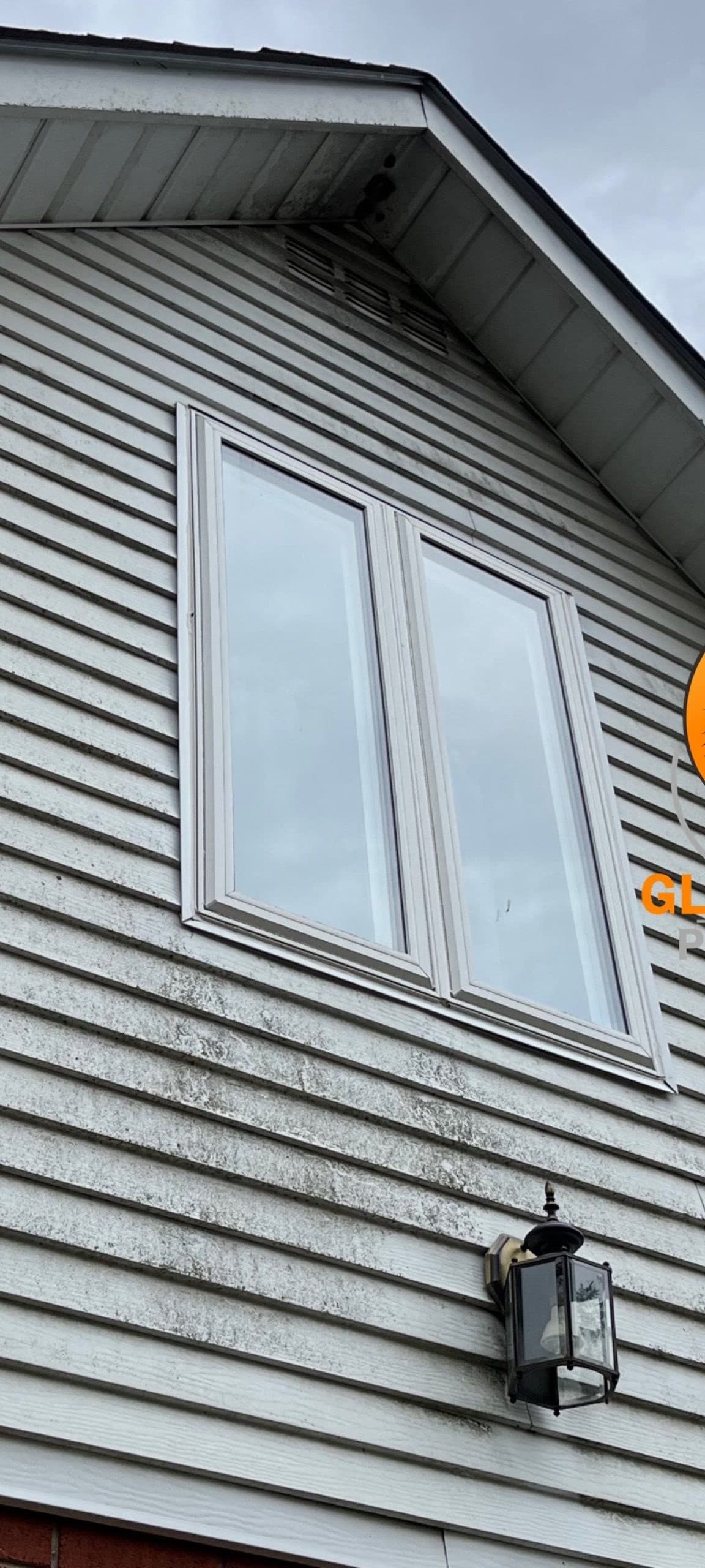 White siding, north gable — before cleaning